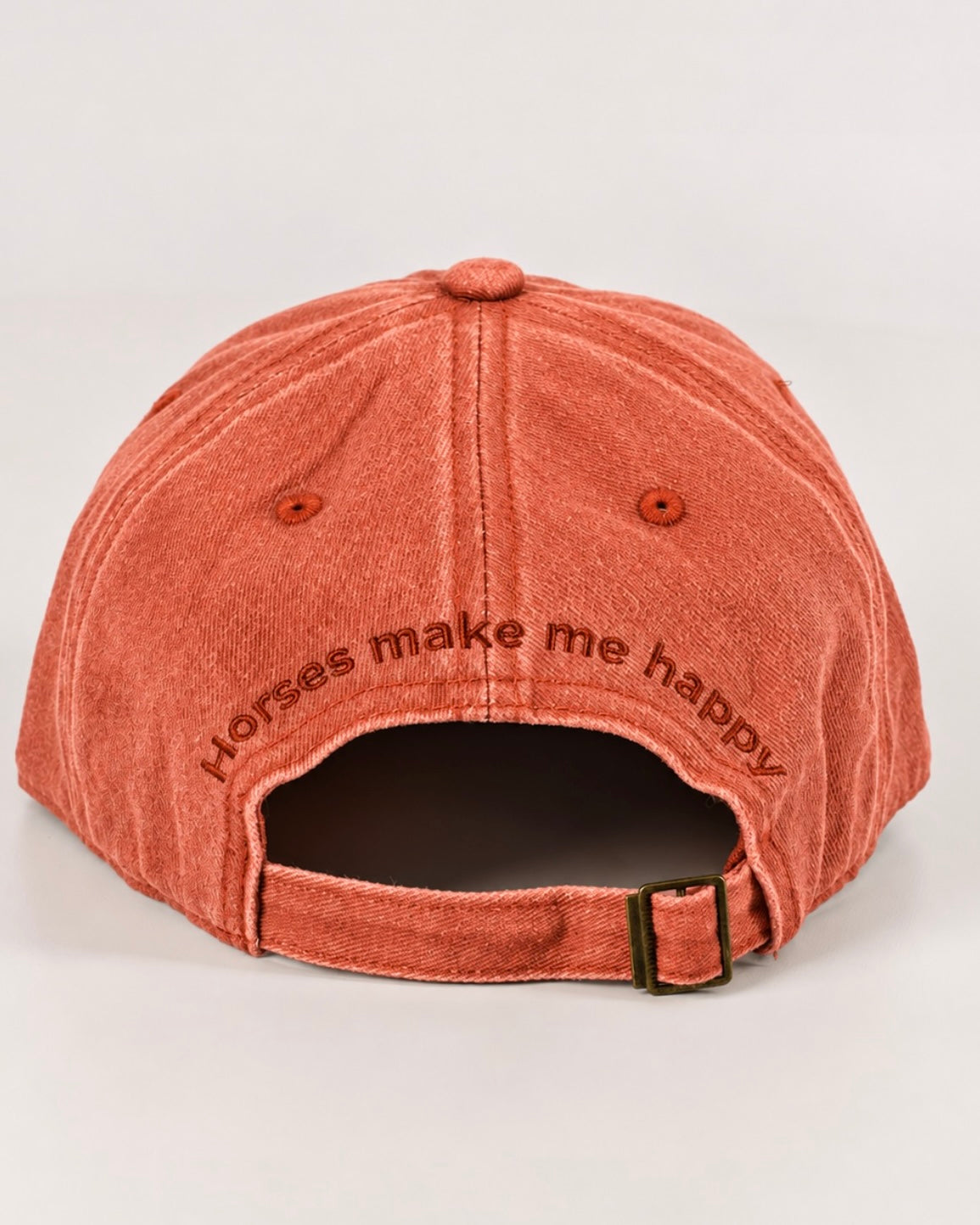 Horzehoods Burnt Orange cotton cap, back view showing the embroidered Horses Make Me Happy slogan and adjustable strap