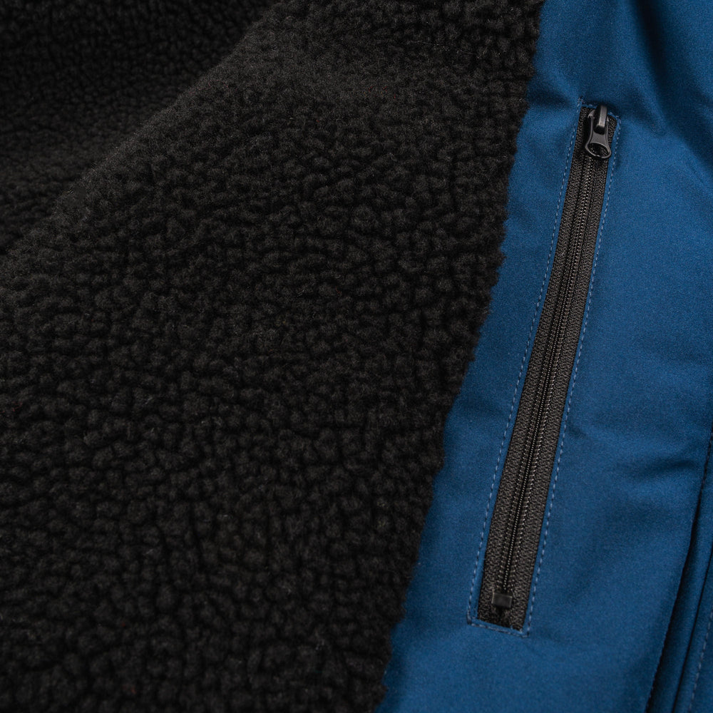 Sherpa thick liner showing how thick horzehoods cost is and showing internal pocket 